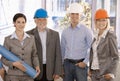 Smiling designer team wearing hardhat