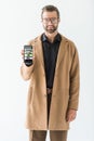 smiling developer presenting smartphone with SEO ideas