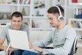 Smiling disabled student with classmate working at home Royalty Free Stock Photo