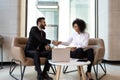 Smiling diverse business partners shaking hands at meeting Royalty Free Stock Photo