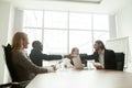 Smiling diverse businessmen in suits handshaking at board office Royalty Free Stock Photo