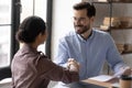 Smiling diverse businesspeople handshake greeting at meeting Royalty Free Stock Photo