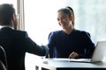 Smiling businesspeople shake hands closing deal at meeting Royalty Free Stock Photo
