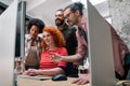 Smiling diverse colleagues gather in boardroom brainstorm discuss financial statistics together Royalty Free Stock Photo