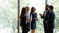 Smiling diverse colleagues have fun talking in office Royalty Free Stock Photo