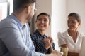 Smiling diverse colleagues talk discussing ideas together Royalty Free Stock Photo