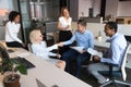 Smiling employees handshake getting acquainted at informal meeting Royalty Free Stock Photo