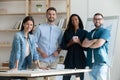 Smiling diverse employees standing in modern boardroom, group portrait Royalty Free Stock Photo