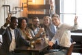 Smiling diverse millennial colleagues posing for picture in cafe Royalty Free Stock Photo