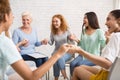 Smiling Diverse Women Sitting In Circle During Group Therapy Indoor