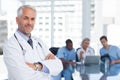 Smiling doctor with arms folded Royalty Free Stock Photo