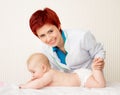 Smiling doctor with small baby Royalty Free Stock Photo