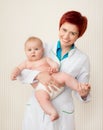 Smiling doctor with small baby Royalty Free Stock Photo