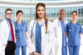 Smiling doctor in front of her medical team