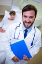 Smiling doctor holding a medical report Royalty Free Stock Photo