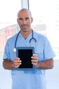 Smiling doctor holding tablet computer Royalty Free Stock Photo