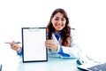 Smiling doctor indicating writing pad Royalty Free Stock Photo