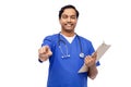 smiling doctor or male nurse pointing to camera Royalty Free Stock Photo