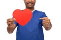 smiling doctor or male nurse with red heart Royalty Free Stock Photo