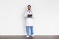 Smiling Doctor Man In Medical Coat With Clipboard In Hands Royalty Free Stock Photo