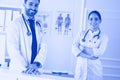 Smiling doctor man standing in front of his team and patient Royalty Free Stock Photo