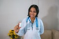 A smiling doctor with a medicine bottle Royalty Free Stock Photo