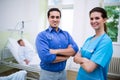 Smiling doctor and nurse standing with arms crossed Royalty Free Stock Photo