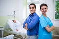 Smiling doctor and nurse standing with arms crossed Royalty Free Stock Photo