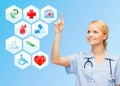 Smiling doctor over medical icons blue background Royalty Free Stock Photo