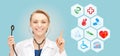 Smiling doctor over medical icons blue background Royalty Free Stock Photo