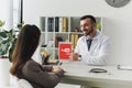 smiling doctor pointing on tablet with loaded youtube page