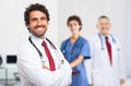 Smiling doctor portrait with his team Royalty Free Stock Photo