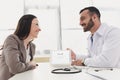 smiling doctor showing patient tablet with loaded google page