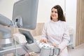 Smiling doctor sitting near the ultrasound scanner Royalty Free Stock Photo