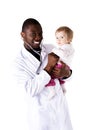 Smiling doctor with small baby Royalty Free Stock Photo