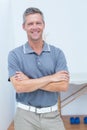 Smiling doctor standing arms crossed Royalty Free Stock Photo