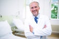 Smiling doctor standing with arms crossed Royalty Free Stock Photo