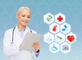 Smiling doctor with tablet pc and medical symbols Royalty Free Stock Photo