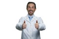 Smiling doctor with thumbs up.