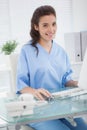 Smiling doctor using mouse of computer Royalty Free Stock Photo