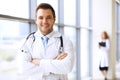 Smiling doctor waiting for his team while standing upright Royalty Free Stock Photo