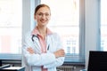 Smiling doctor woman in her office Royalty Free Stock Photo