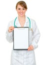 Smiling doctor woman holding blank clipboard