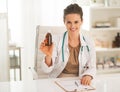 Smiling doctor woman showing medicine bottle Royalty Free Stock Photo