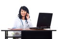 Smiling doctor woman speaking by phone Royalty Free Stock Photo