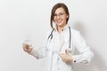 Smiling doctor woman with stethoscope, glasses isolated on white background. Female doctor in medical gown holding glass Royalty Free Stock Photo