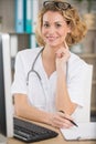 smiling doctor working at office desk Royalty Free Stock Photo