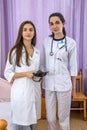 Smiling doctors young and confident posing in hospital for camera