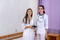 Smiling doctors young and confident posing in hospital for camera Royalty Free Stock Photo