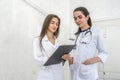 Smiling doctors young and confident posing in hospital for camera